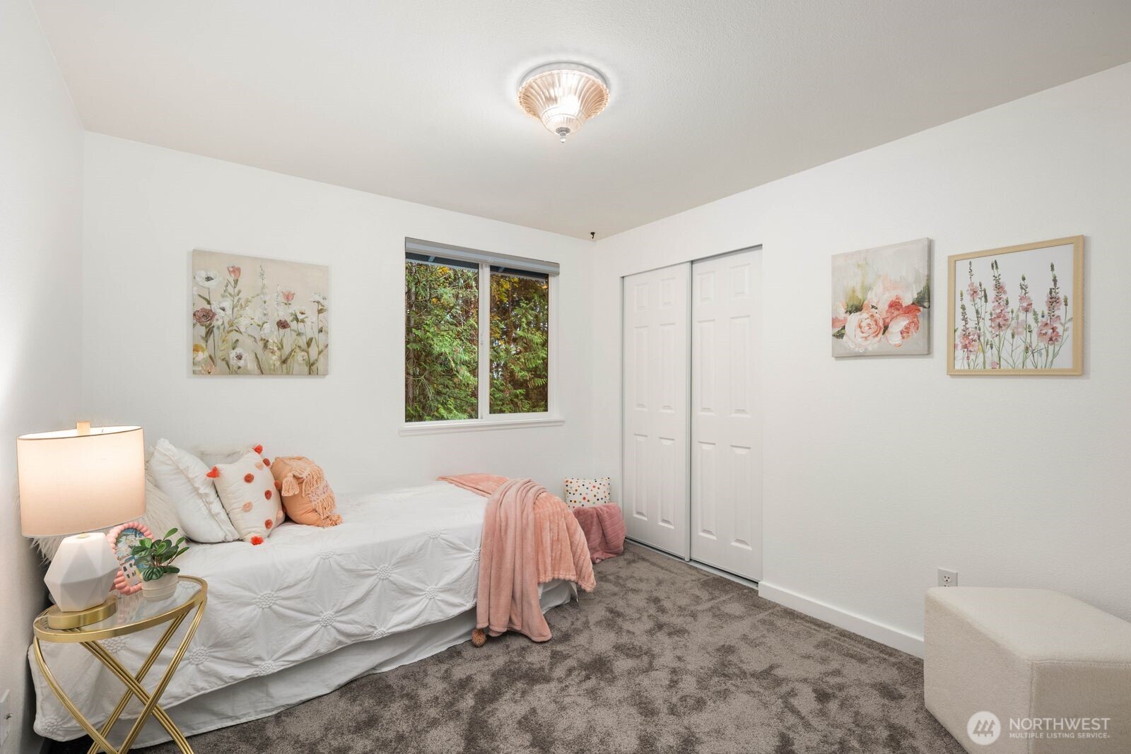 1947 Northeast 23rd Street Renton, WA 98056 - Photo 23 of 36 a bedroom with a bed and a window