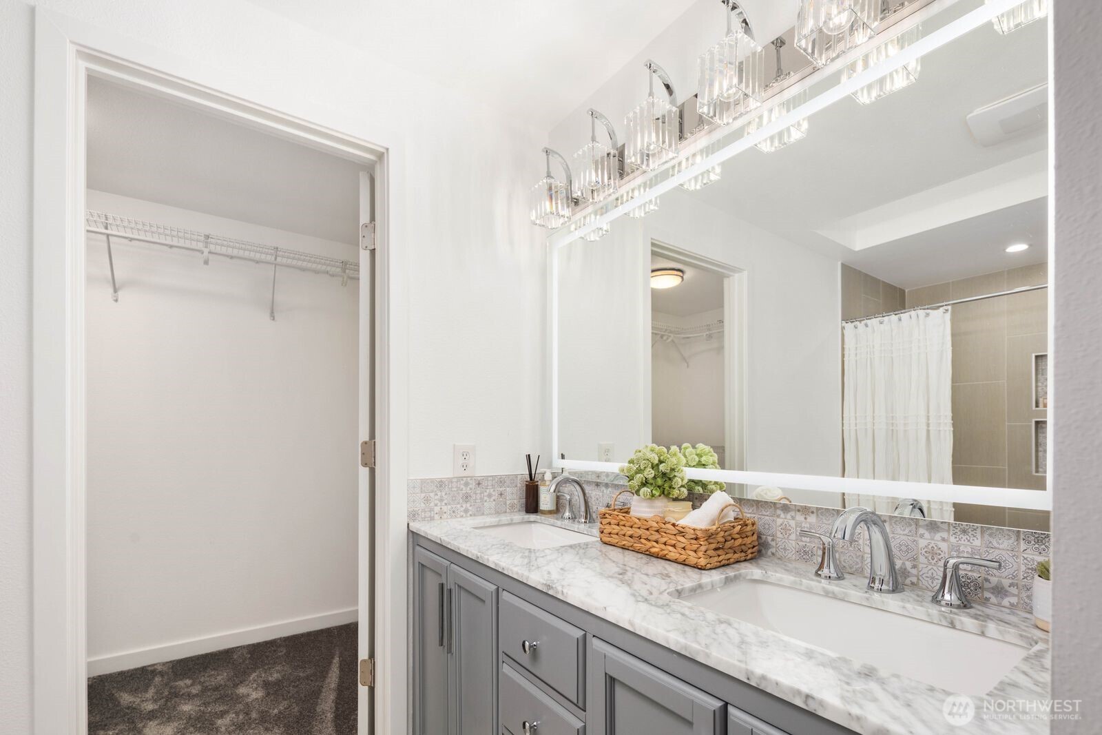 1947 Northeast 23rd Street Renton, WA 98056 - Photo 27 of 36 a bathroom with a granite countertop sink and a mirror