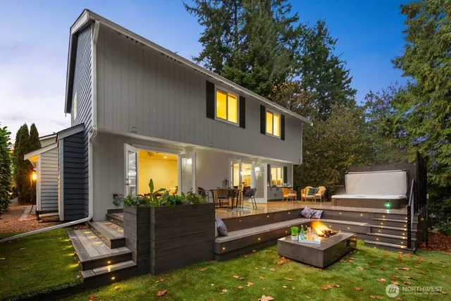 a view of a patio with couches chairs and a fire pit