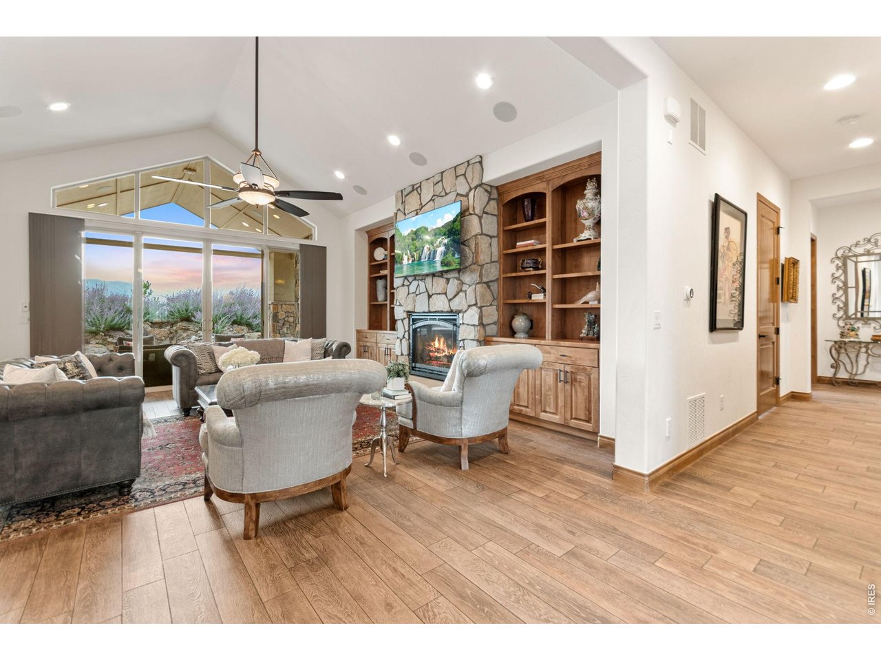 9567 Poppy Way Arvada, CO 80007 - Photo 11 of 48 a living room with fireplace furniture and a large window