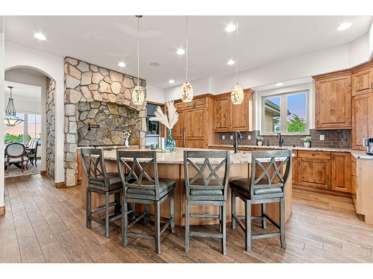9567 Poppy Way Arvada, CO 80007 - Photo 14 of 48 a dining hall with stainless steel appliances a dining table and chairs