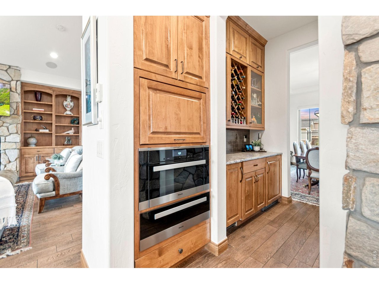 9567 Poppy Way Arvada, CO 80007 - Photo 18 of 48 a kitchen with stainless steel appliances granite countertop a stove and a refrigerator