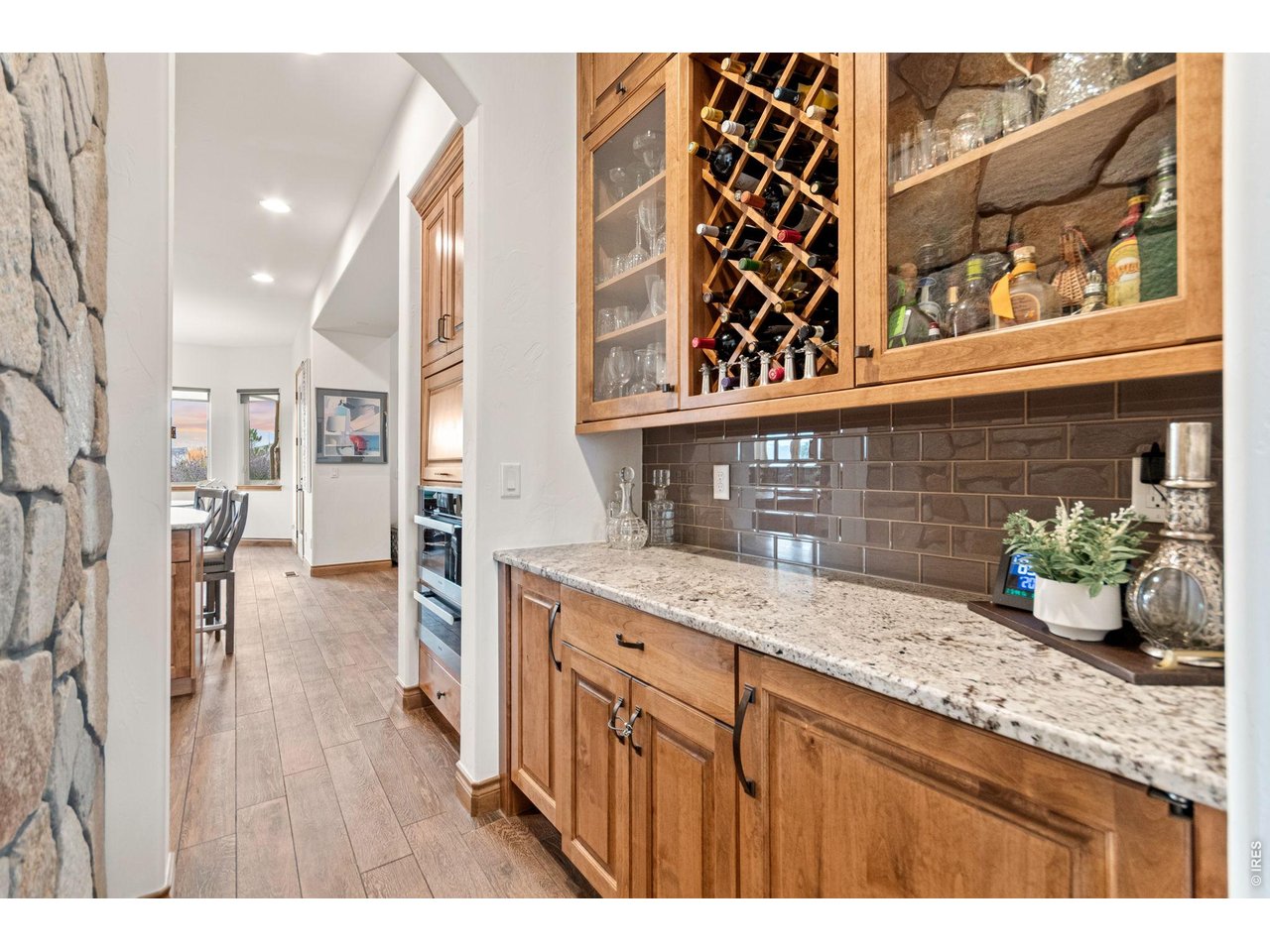 9567 Poppy Way Arvada, CO 80007 - Photo 19 of 48 a view of a kitchen with a sink and wooden floor