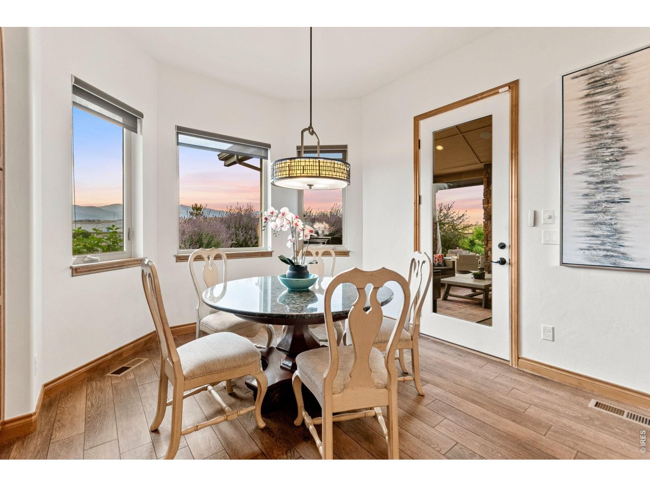 9567 Poppy Way Arvada, CO 80007 - Photo 20 of 48 a dining room with furniture window wooden floor