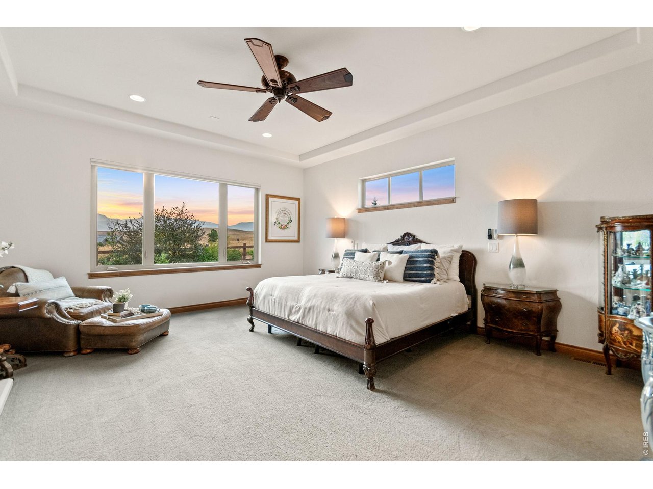 9567 Poppy Way Arvada, CO 80007 - Photo 22 of 48 a spacious bedroom with a bed and a window