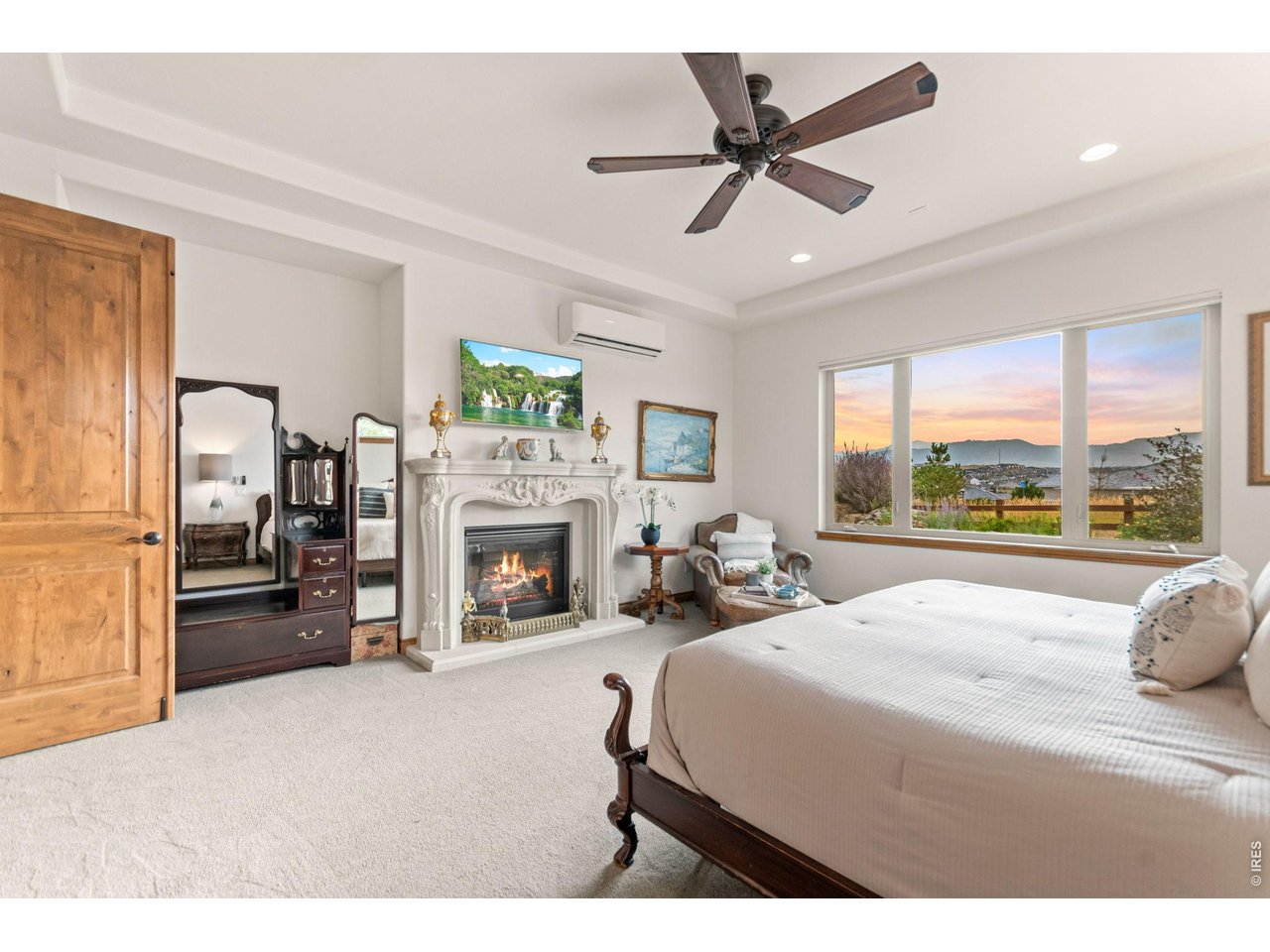 9567 Poppy Way Arvada, CO 80007 - Photo 23 of 48 a bed room with a bed and a fireplace