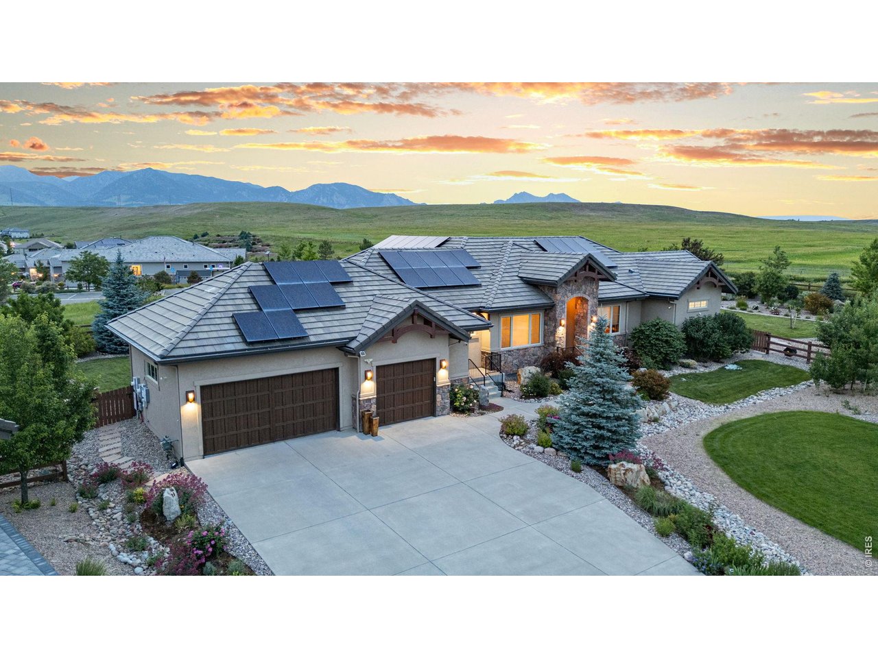 9567 Poppy Way Arvada, CO 80007 - Photo 48 of 48 a picture of a building with an outdoor space and seating area