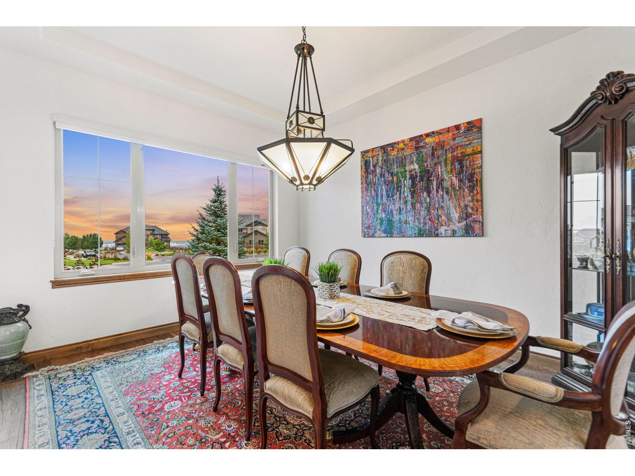 9567 Poppy Way Arvada, CO 80007 - Photo 9 of 48 a view of a dining room with furniture window and wooden floor