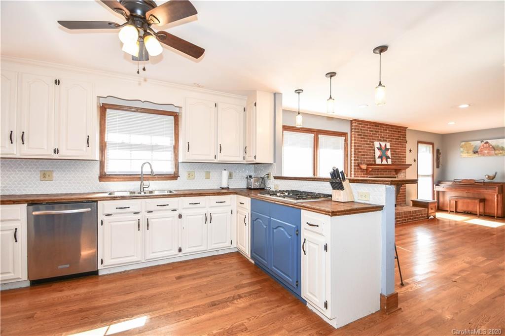 1408 Mills Harris Road Wingate, NC 28174 - Photo 11 of 23 a kitchen with stainless steel appliances granite countertop a stove and cabinets