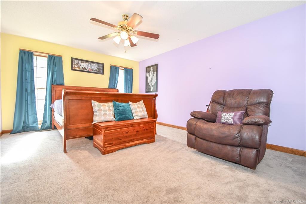 1408 Mills Harris Road Wingate, NC 28174 - Photo 23 of 23 a bedroom with furniture and a ceiling fan