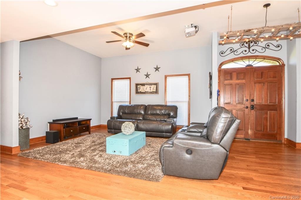 1408 Mills Harris Road Wingate, NC 28174 - Photo 6 of 23 a living room with furniture and a wooden floor