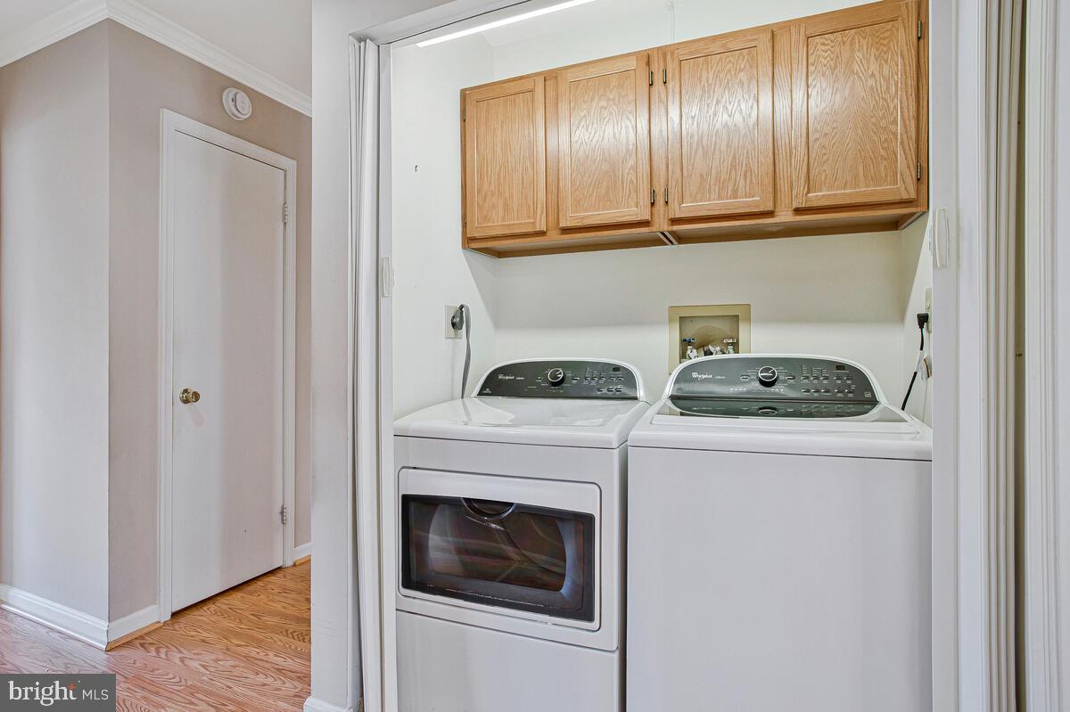 9264 Cherry Lane, Unit 47 Laurel, MD 20708 - Photo 13 of 32 a utility room with dryer and washer