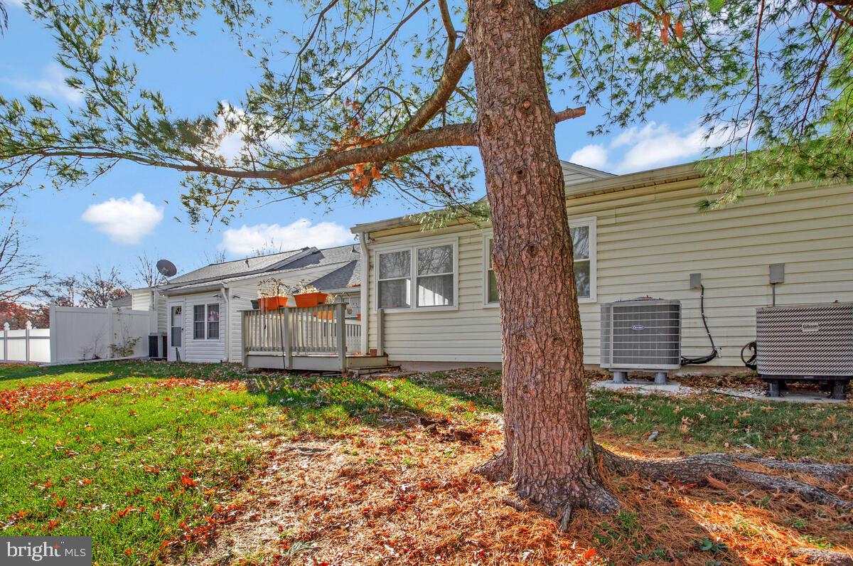 9264 Cherry Lane, Unit 47 Laurel, MD 20708 - Photo 27 of 32 a view of a house with a yard and large tree