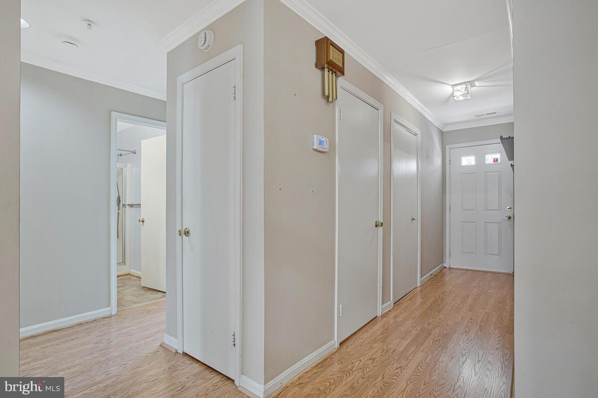 9264 Cherry Lane, Unit 47 Laurel, MD 20708 - Photo 6 of 32 a view of a hallway with wooden floor