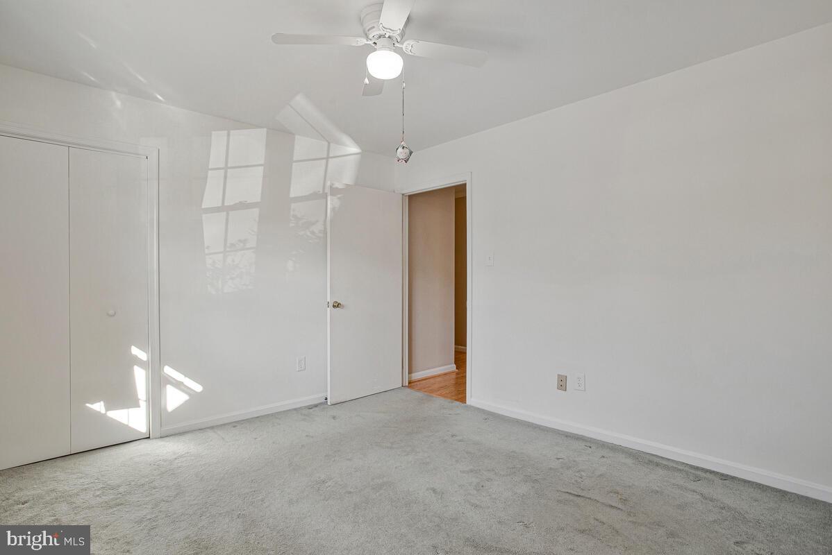 9264 Cherry Lane, Unit 47 Laurel, MD 20708 - Photo 8 of 32 a view of an empty room with a chandelier fan