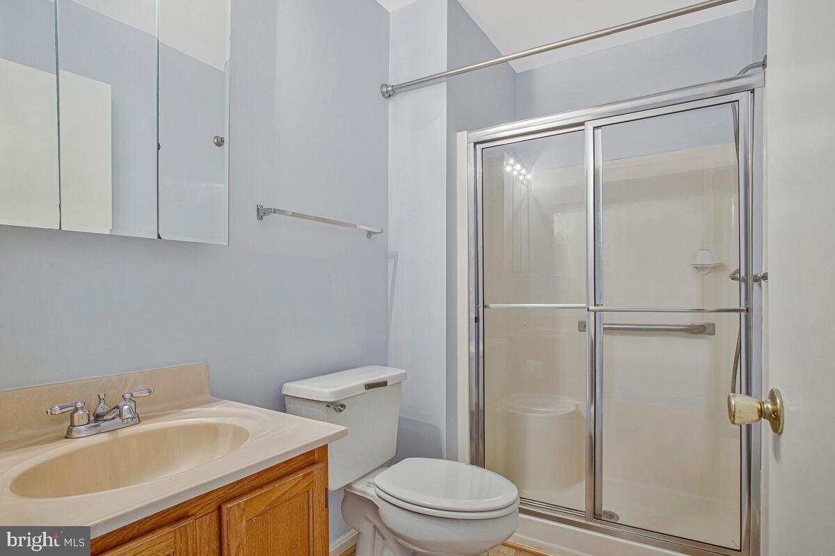 9264 Cherry Lane, Unit 47 Laurel, MD 20708 - Photo 9 of 32 a bathroom with a sink toilet and vanity