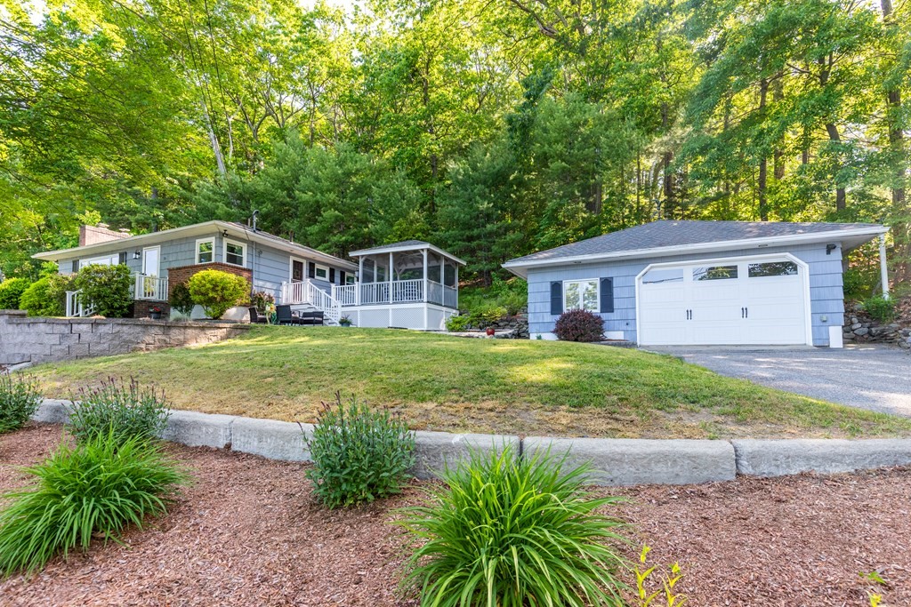 33 Keyes Road Westford, MA 01886 - Photo 1 of 42 a view of house with garden space and sitting area