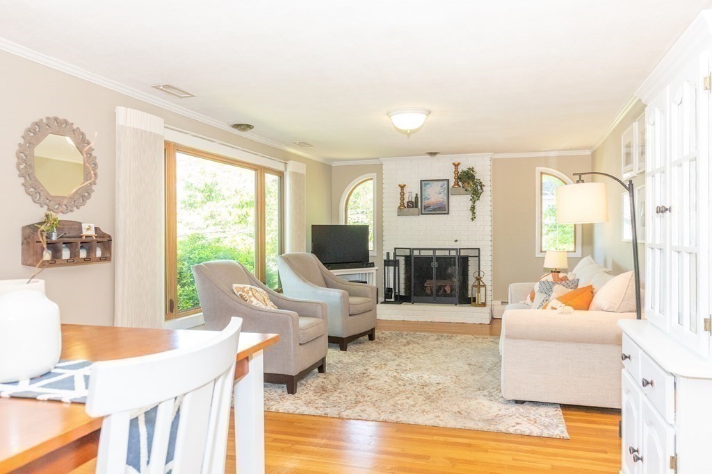 33 Keyes Road Westford, MA 01886 - Photo 12 of 42 a living room with fireplace furniture and a large window