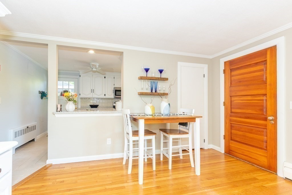33 Keyes Road Westford, MA 01886 - Photo 13 of 42 a dining room with wooden floor and large window