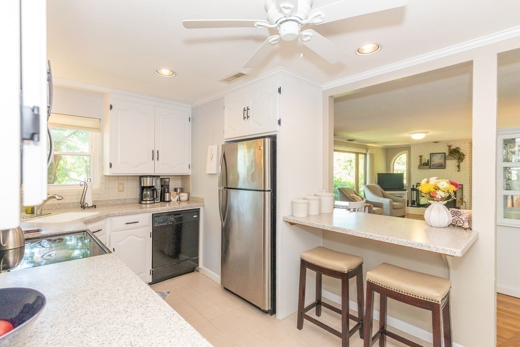 33 Keyes Road Westford, MA 01886 - Photo 14 of 42 a kitchen with a refrigerator a sink cabinets and appliances