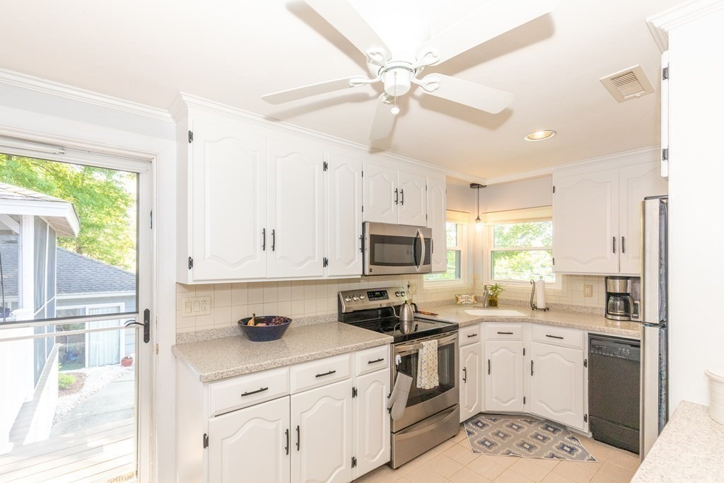 33 Keyes Road Westford, MA 01886 - Photo 16 of 42 a kitchen with appliances cabinets a sink and a window