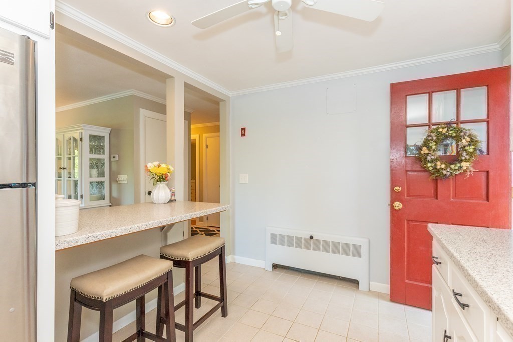 33 Keyes Road Westford, MA 01886 - Photo 18 of 42 a room with a table and chairs