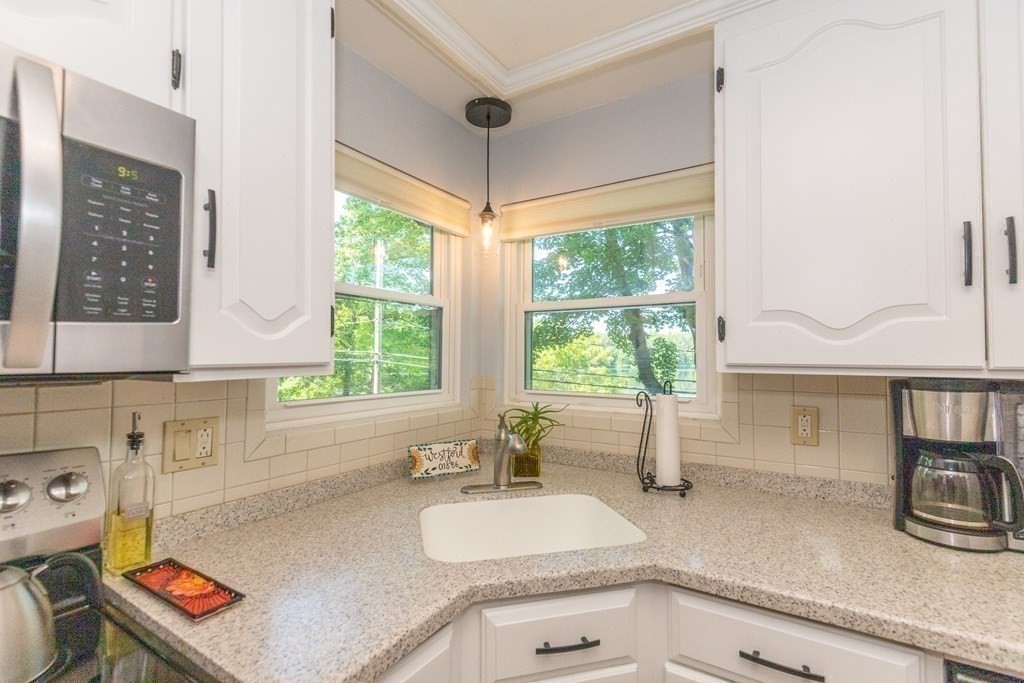 33 Keyes Road Westford, MA 01886 - Photo 19 of 42 a kitchen with sink refrigerator and window