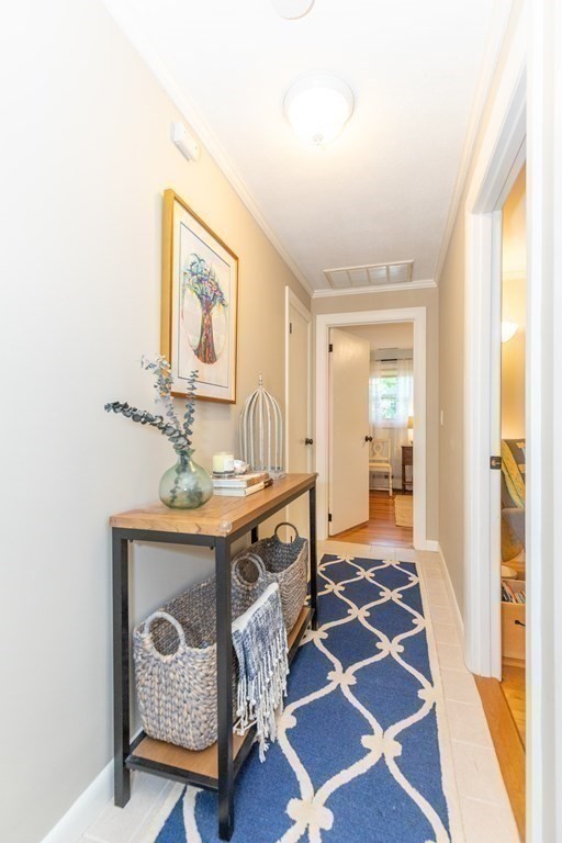 33 Keyes Road Westford, MA 01886 - Photo 20 of 42 a living room with a rug and a table