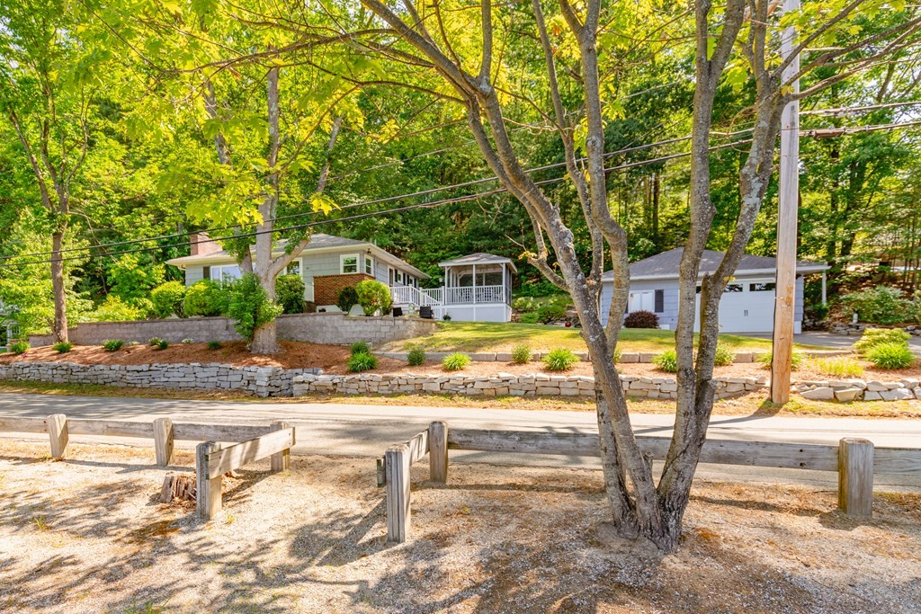 33 Keyes Road Westford, MA 01886 - Photo 2 of 42 a view of a swimming pool with a patio