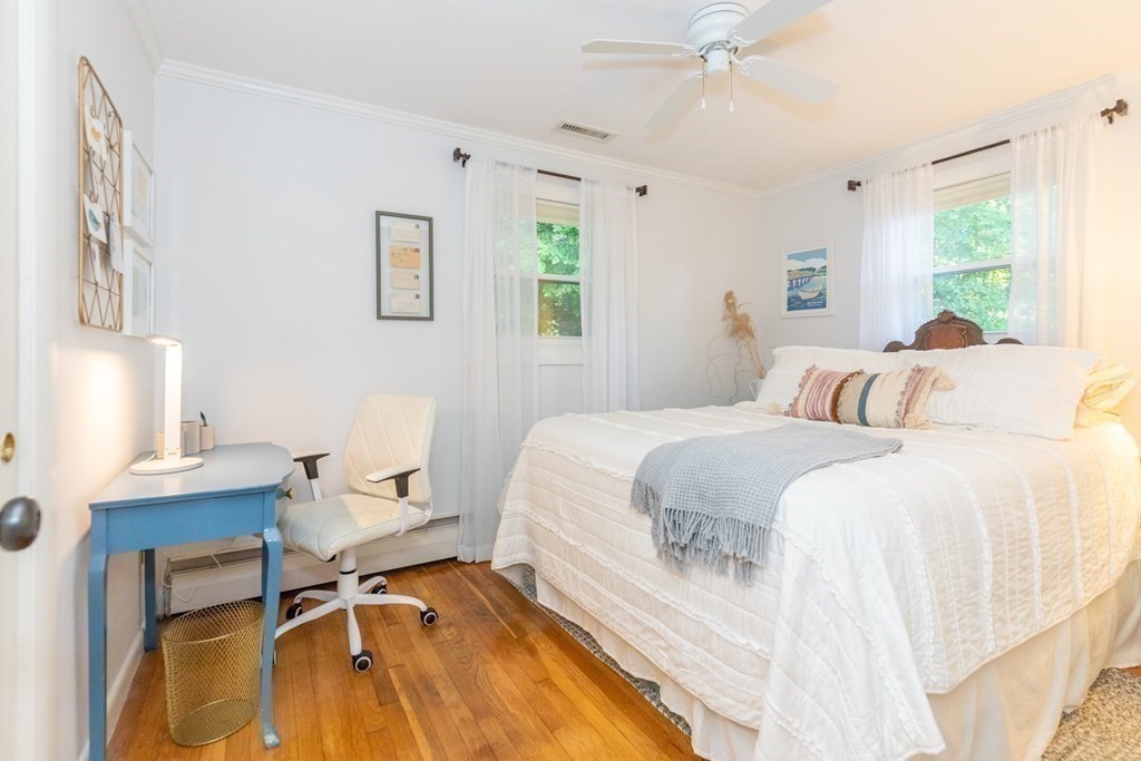 33 Keyes Road Westford, MA 01886 - Photo 23 of 42 a bedroom with a bed and a desk