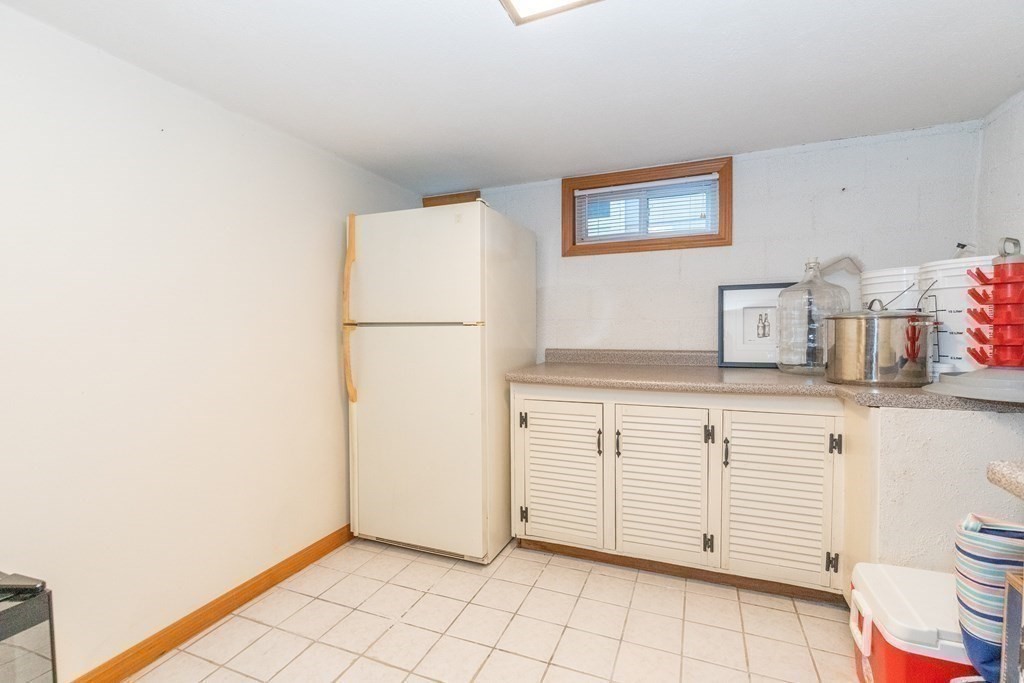 33 Keyes Road Westford, MA 01886 - Photo 29 of 42 a kitchen with a cabinets and white appliances