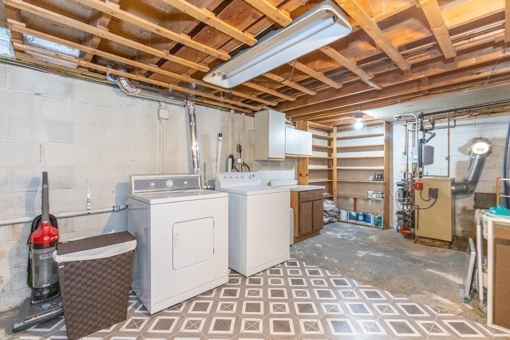 33 Keyes Road Westford, MA 01886 - Photo 30 of 42 a storage room with a washer and dryer
