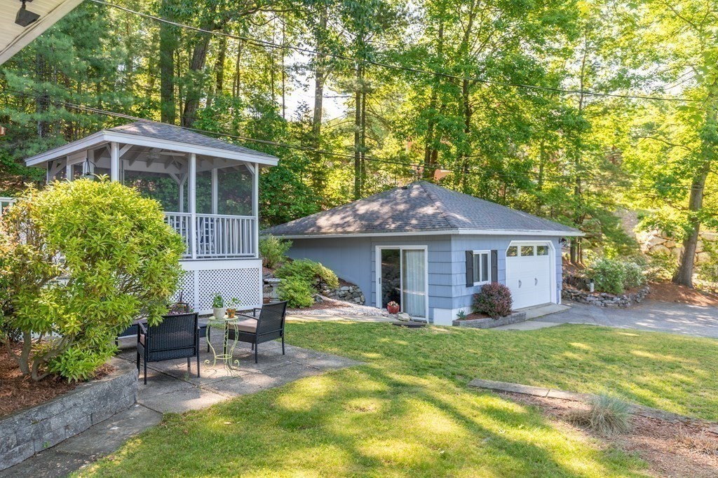 33 Keyes Road Westford, MA 01886 - Photo 3 of 42 a view of a house with a yard and sitting area