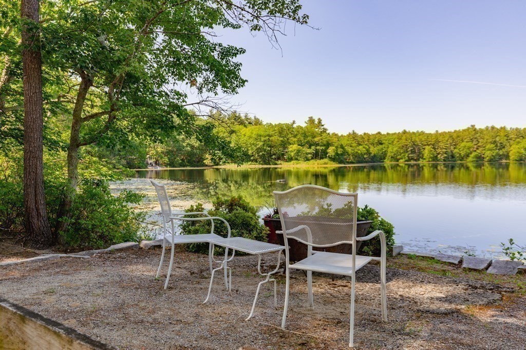 33 Keyes Road Westford, MA 01886 - Photo 35 of 42 a table and chairs with the view of lake