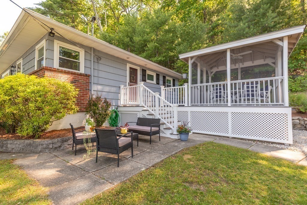 33 Keyes Road Westford, MA 01886 - Photo 38 of 42 a view of a house with backyard and sitting area