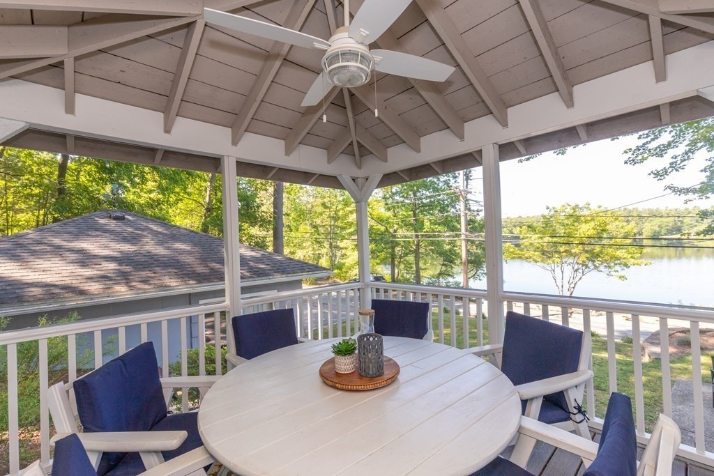 33 Keyes Road Westford, MA 01886 - Photo 39 of 42 a dining room with furniture a rug and a large window