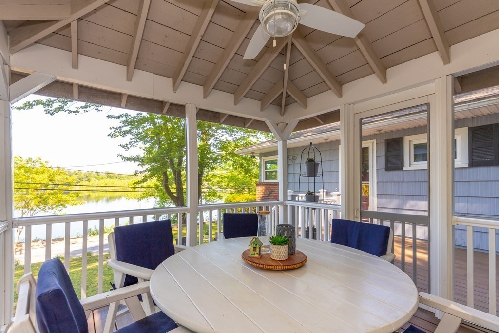 33 Keyes Road Westford, MA 01886 - Photo 40 of 42 a dining room with furniture a chandelier and wooden floor