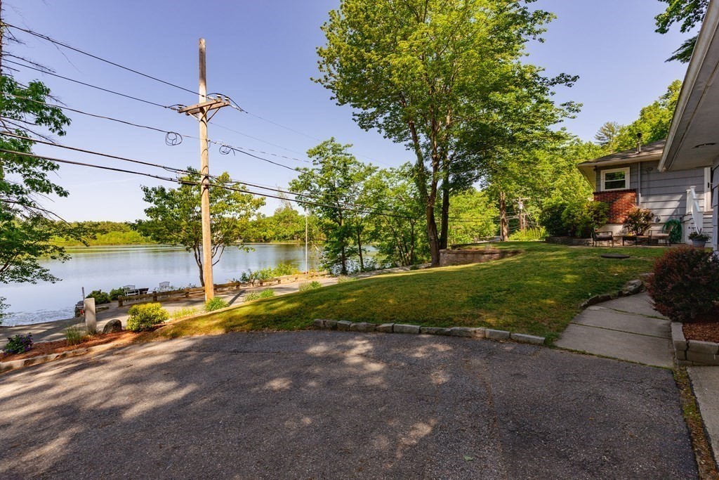 33 Keyes Road Westford, MA 01886 - Photo 41 of 42 a view of a house with backyard and a tree