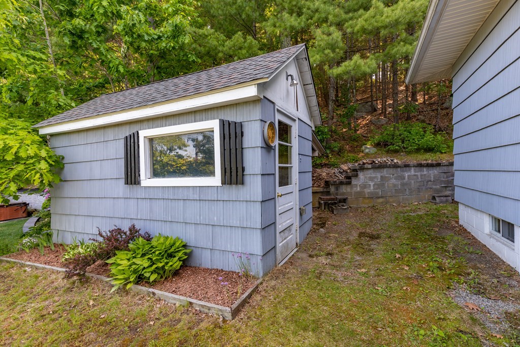 33 Keyes Road Westford, MA 01886 - Photo 42 of 42 a view of a house with a yard and plants