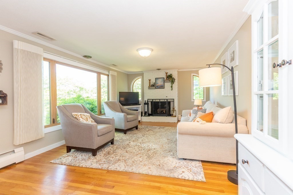33 Keyes Road Westford, MA 01886 - Photo 8 of 42 a living room with furniture and a large window