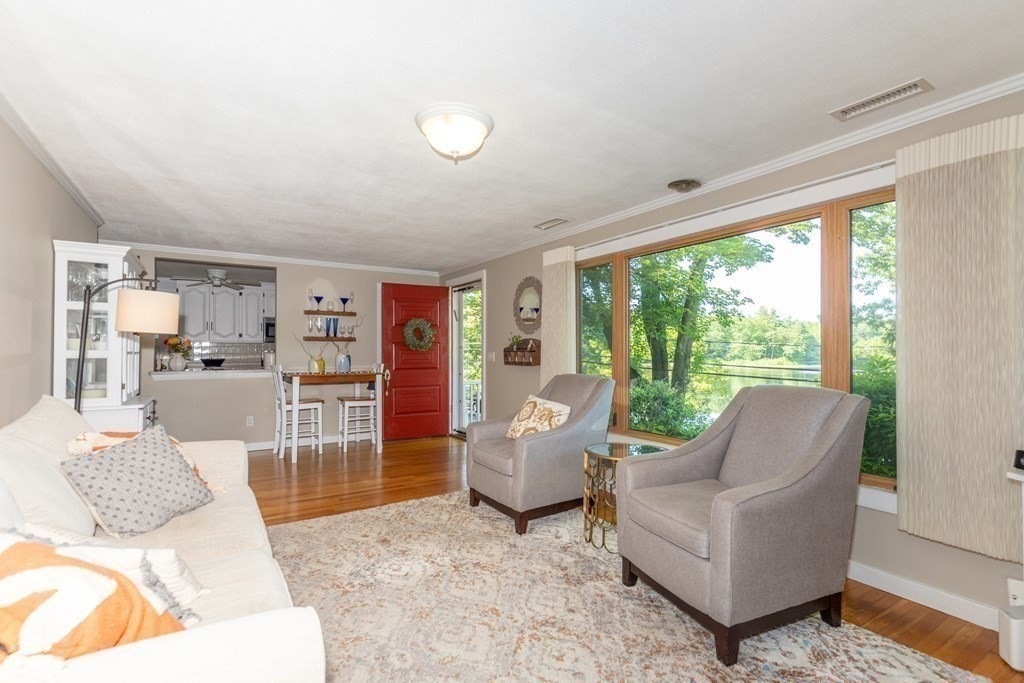33 Keyes Road Westford, MA 01886 - Photo 9 of 42 a living room with furniture and a large window