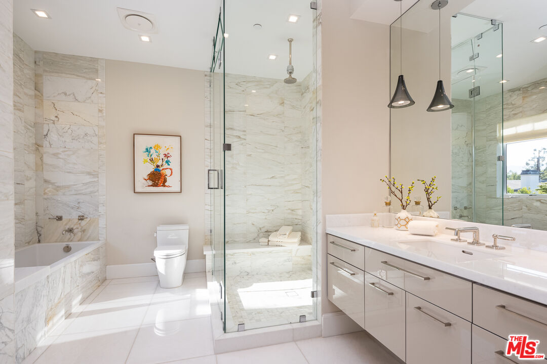 624 North Bonhill Road Los Angeles, CA 90049 - Photo 14 of 48 a bathroom with a double vanity sink toilet and shower