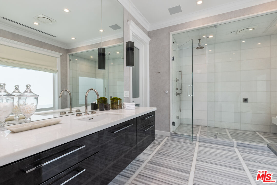 624 North Bonhill Road Los Angeles, CA 90049 - Photo 21 of 48 a bathroom with a double vanity sink mirror and shower