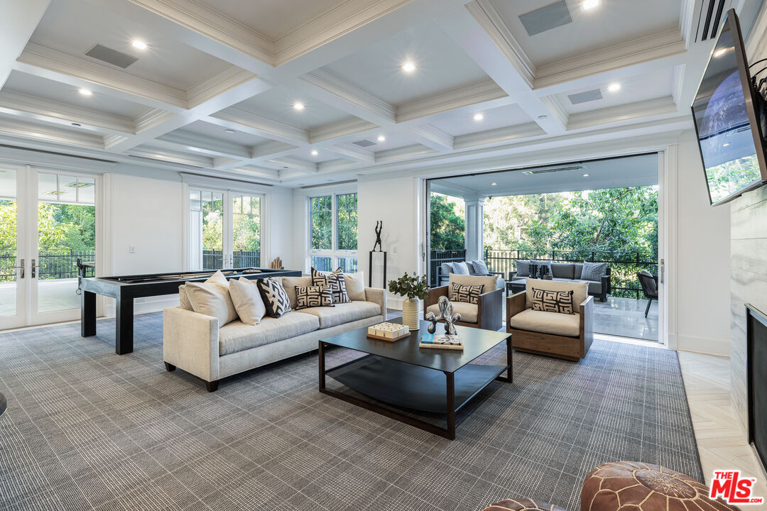 624 North Bonhill Road Los Angeles, CA 90049 - Photo 29 of 48 a living room with furniture and a large window