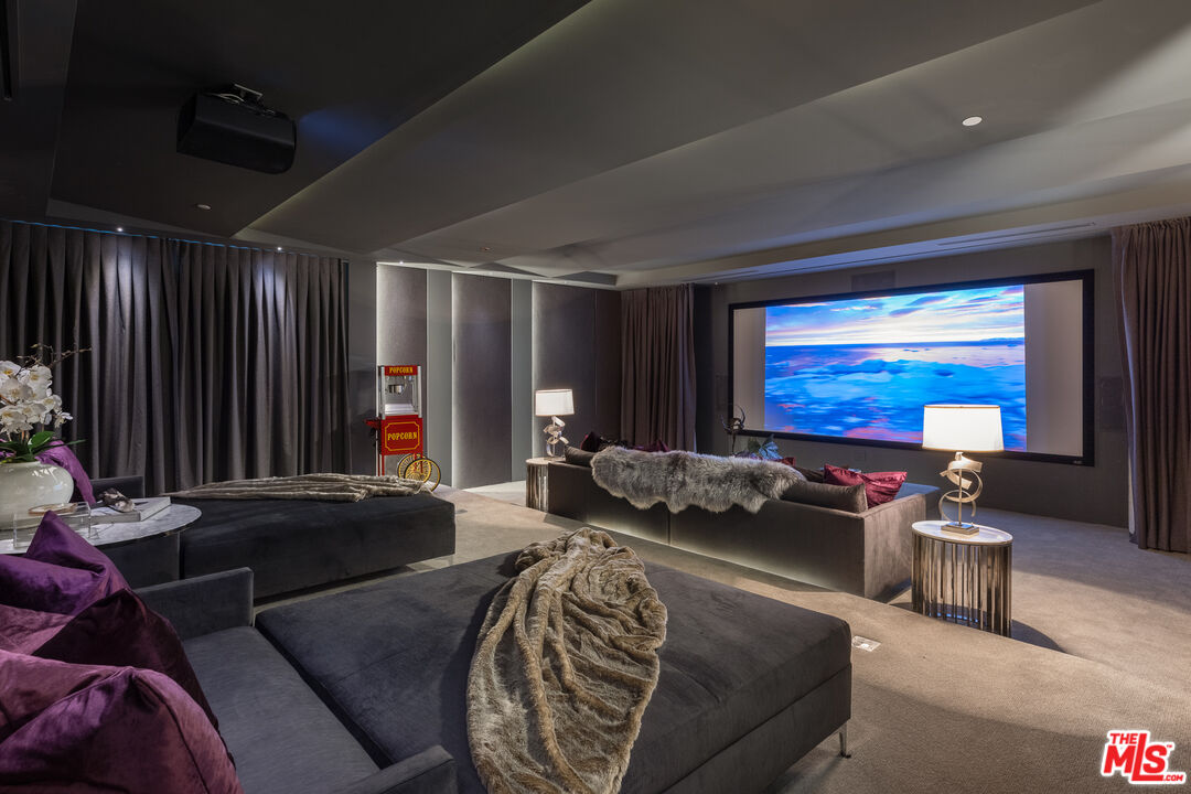 624 North Bonhill Road Los Angeles, CA 90049 - Photo 31 of 48 a livingroom with furniture and a flat screen tv