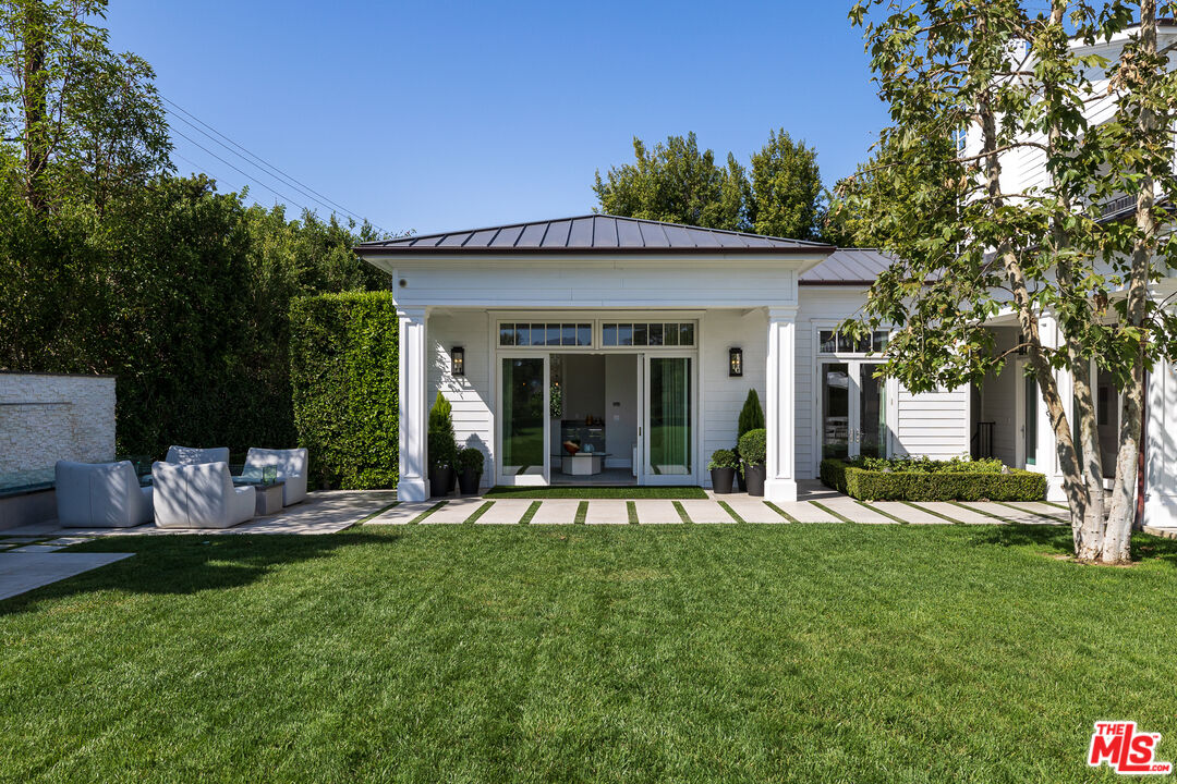 624 North Bonhill Road Los Angeles, CA 90049 - Photo 36 of 48 a view of a house with backyard porch and sitting area