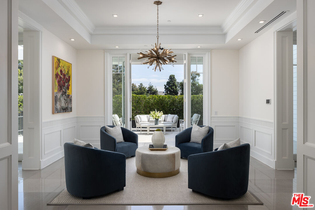 624 North Bonhill Road Los Angeles, CA 90049 - Photo 6 of 48 a living room with furniture and a chandelier