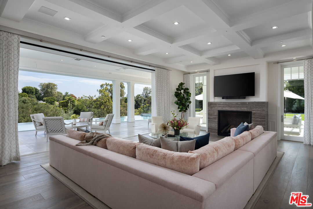624 North Bonhill Road Los Angeles, CA 90049 - Photo 7 of 48 a living room with furniture fireplace and a large window