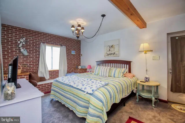 a bedroom with a bed and a table