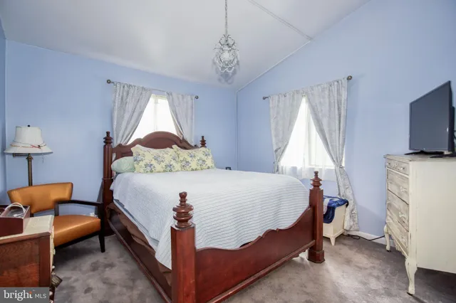 a bed room with a bed and a window